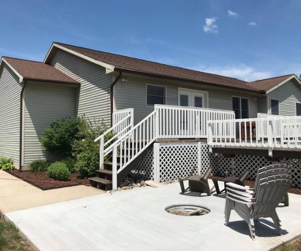 gray home with white deck and gutter system